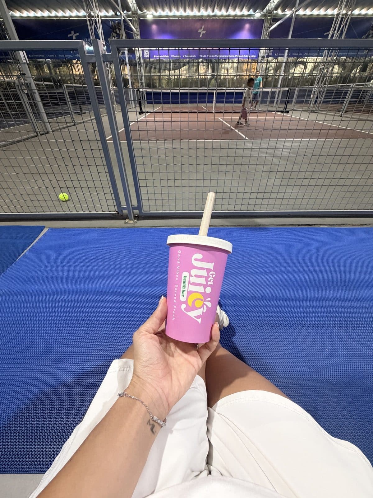 A Juicy cup at a padel court