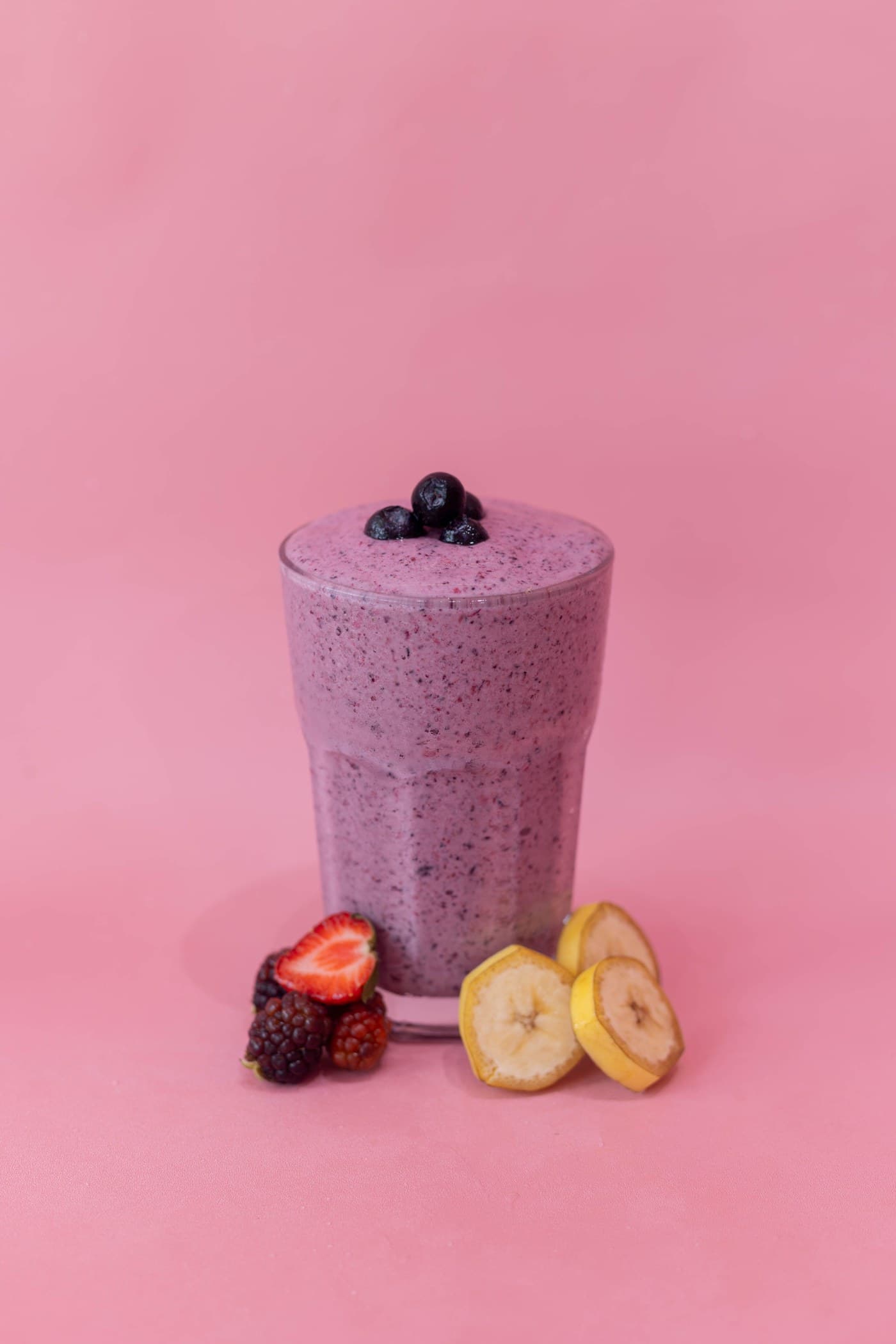 A purple smoothie with berries and banana